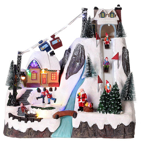 christmas village animated skaters and skiers 30x30x20 cm